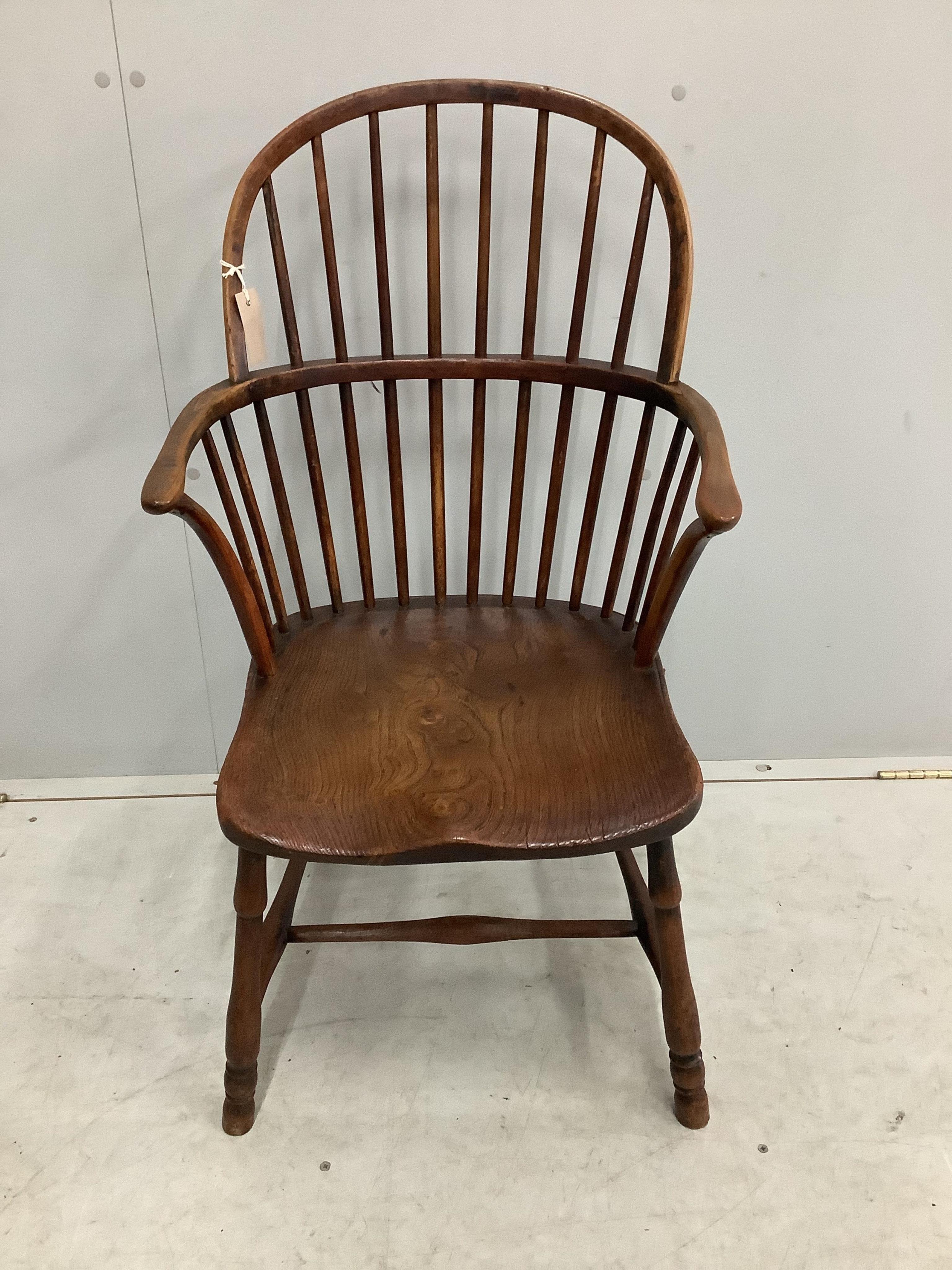 A 19th century Thames Valley elm and beech comb back Windsor elbow chair, width 49cm, depth 41cm, height 93cm. Condition - fair